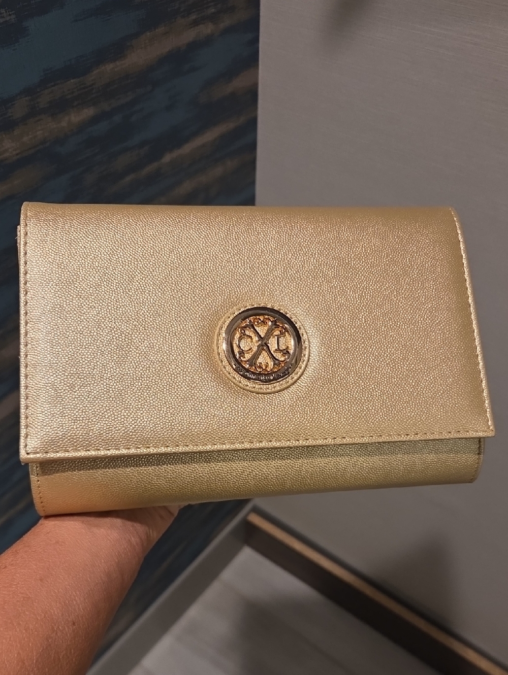 Christian Lacroix Metallic Gold Clutch with Signature Emblem